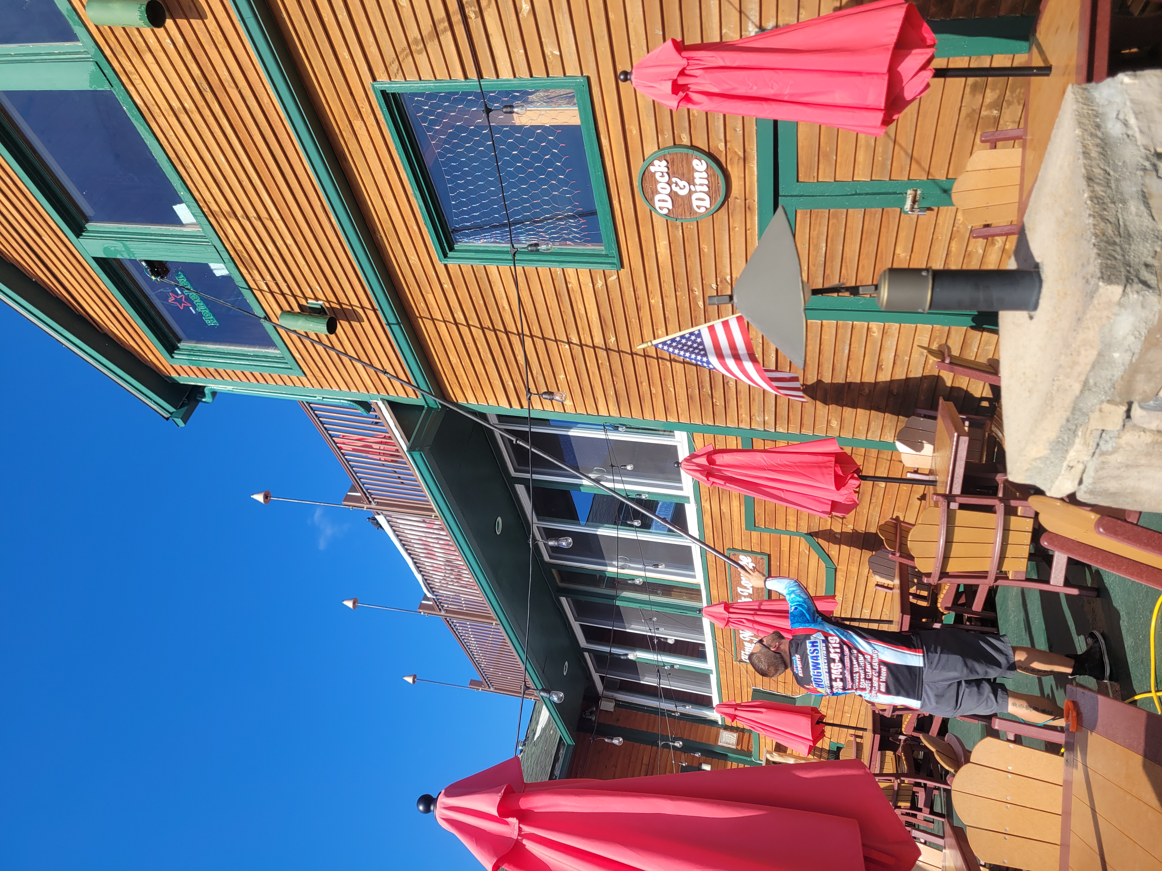 Commercial building with clean cedar siding and outdoor seating area