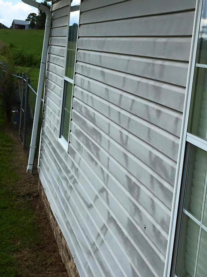 Damaged vinyl siding from improper power washing