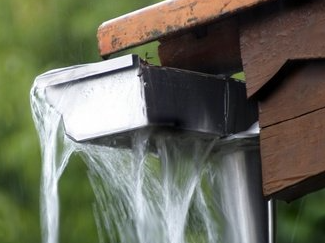 Water overflowing from clogged gutter