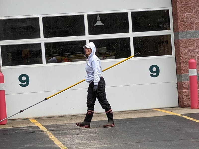 Technician performing soft washing